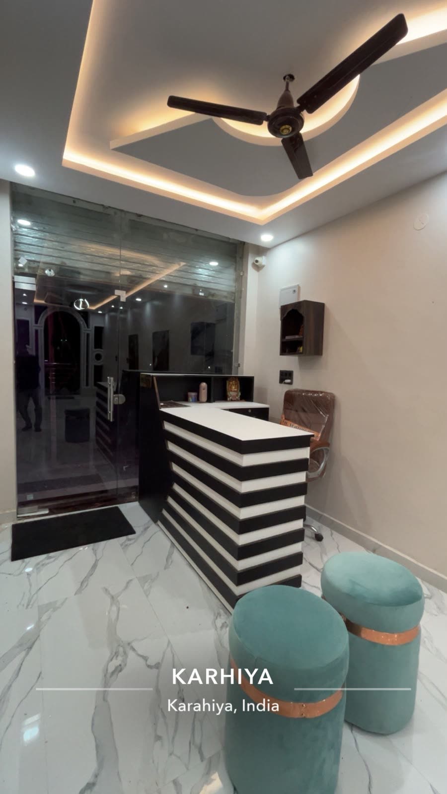 Reception desk with velvet poufs